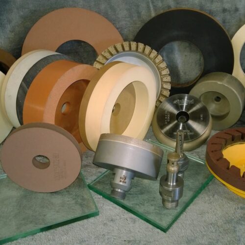 Polishing wheels and drill bits for glass